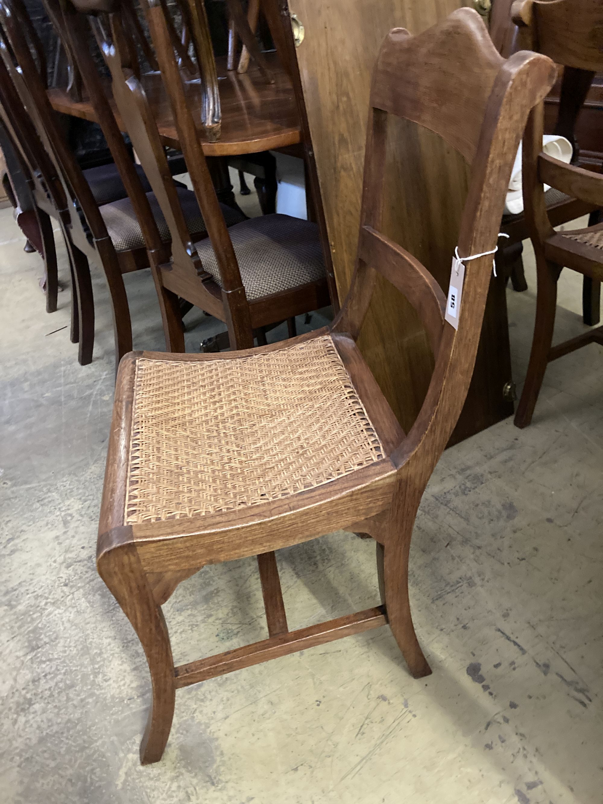 Six Anglo Indian caned hardwood dining chairs